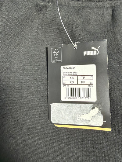Cartellino originale PUMA Evostripe Pants con codice modello e taglia XS