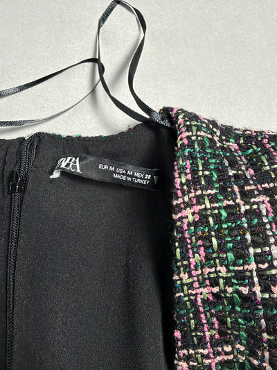 Dettaglio etichetta ZARA con taglia EUR M e zip posteriore