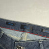 Dettaglio interno vita con etichette Twin-Set T.S.J. Skinny e placchetta a cuore sulla tasca