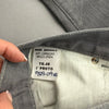 Etichetta interna di composizione e taglia 48 con indicazione Mod. Skinny e 1° Proto