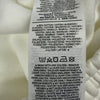 Etichetta composizione Nike con 80% cotone e 20% poliestere