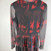 Vista posteriore del vestito Desigual in tulle fantasia nero rosso con gonna a balze