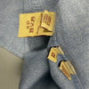 Etichetta interna della camicia U.S. Polo Assn. con taglia 12 e composizione 100% cotone