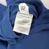 Etichetta composizione dei jogger Ellesse con 87% cotone e 13% poliestere